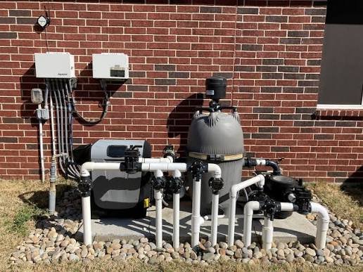 Pool equipment pad with pump, filter and heater serviced in Corona, CA